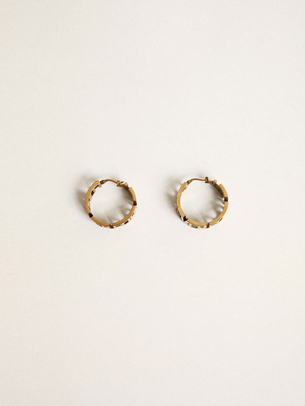 Hoop earrings in antique gold color with Forever For You lettering