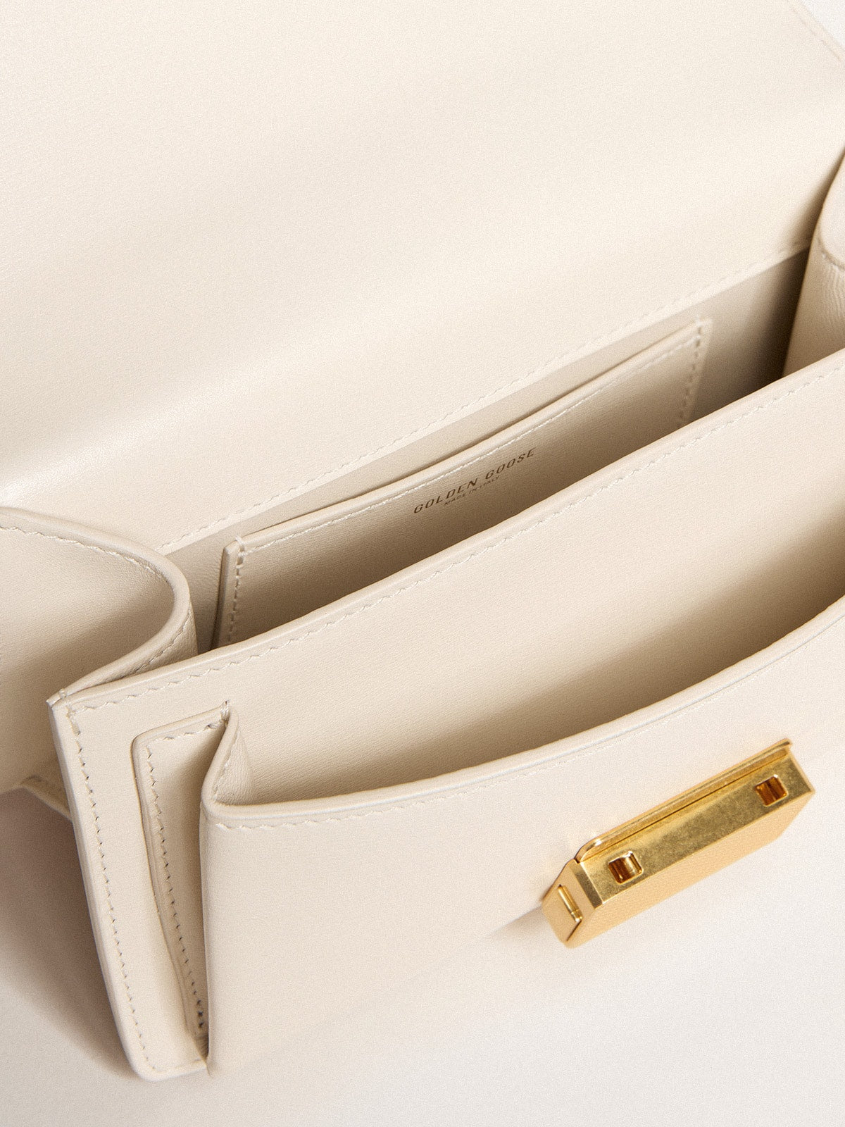 Small Venezia Bag in butter-colored boarded leather with gold details