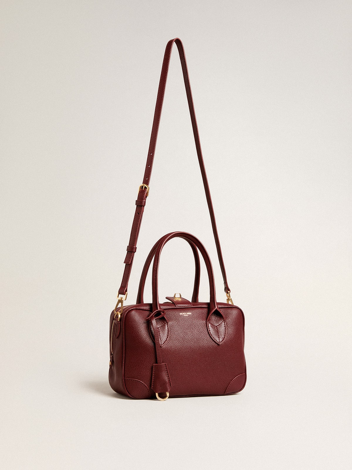 Vita Bag in burgundy sheepskin leather with gold details