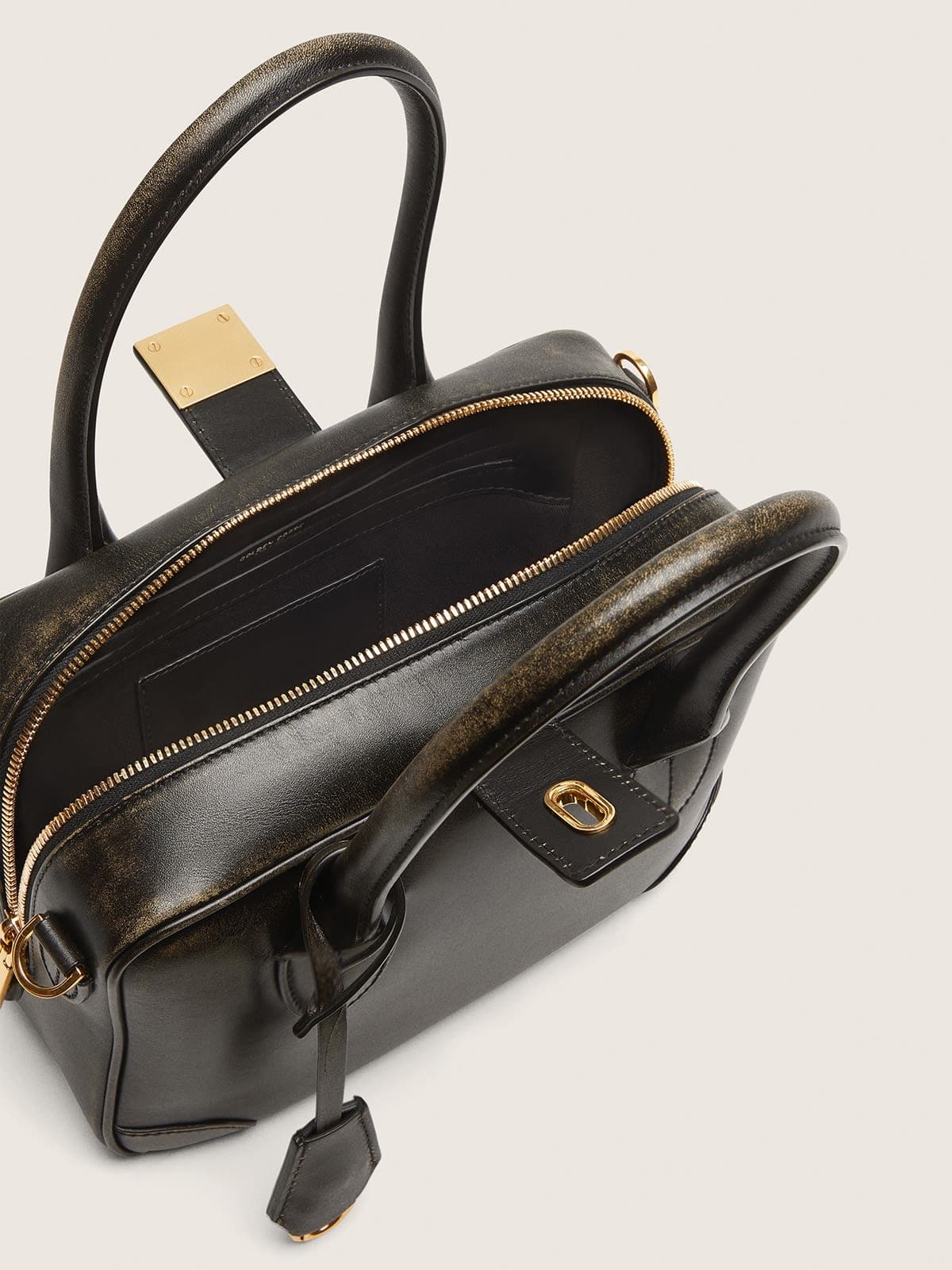 Vita Bag in black distressed leather with gold details
