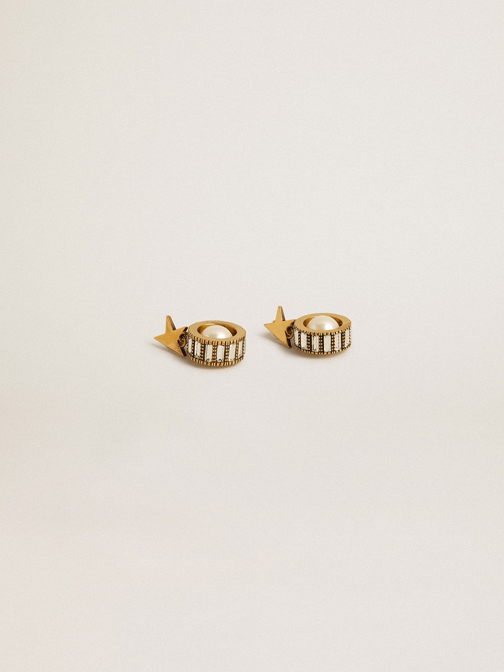 Earrings with gold star and pearl