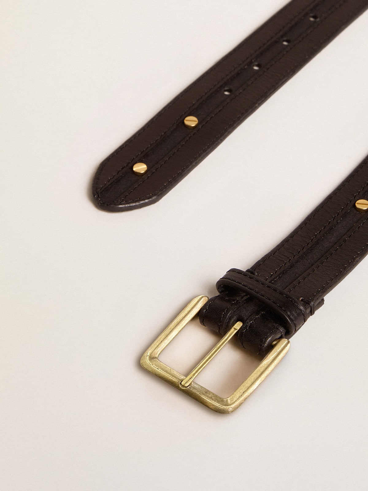 Women’s black belt in washed leather with gold studs