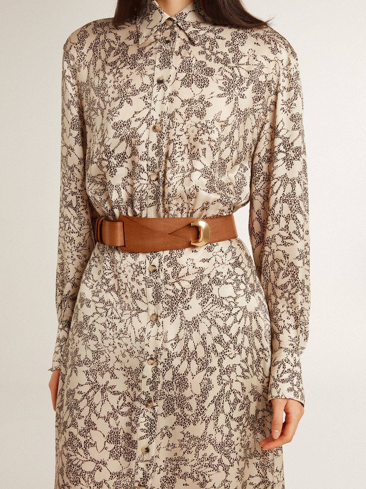 Brown leather belt with semi-circular gold buckle