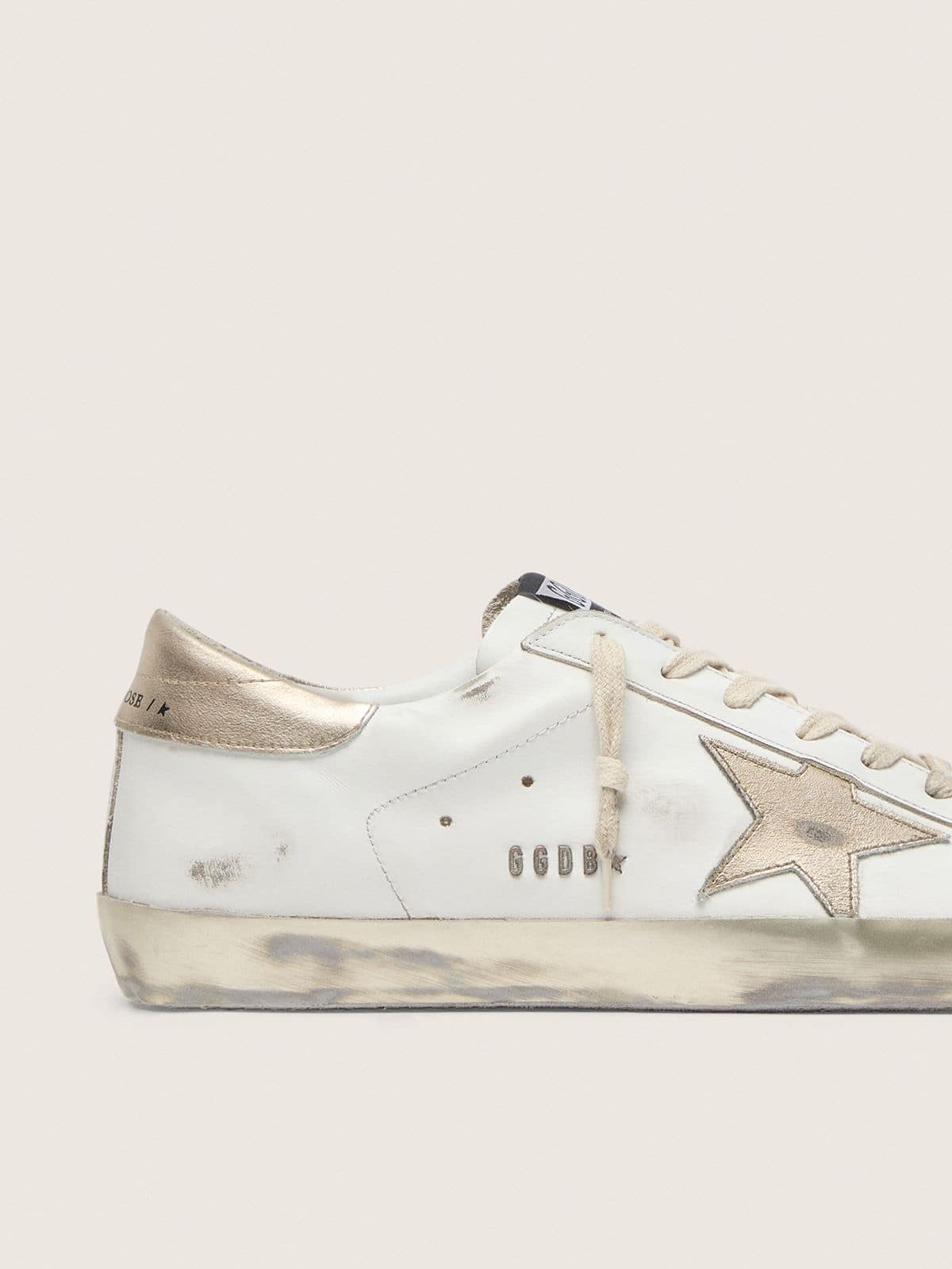 Women's Super-Star with gold sparkle foxing and metal stud lettering