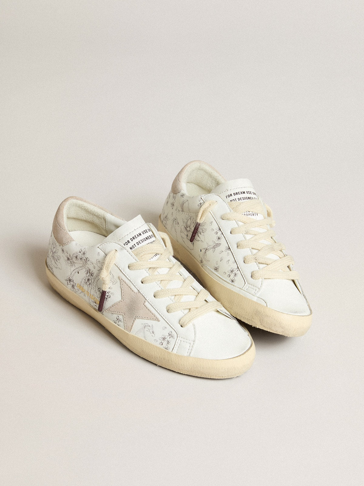 Women’s Super-Star LTD CNY in white leather with lettering on the upper