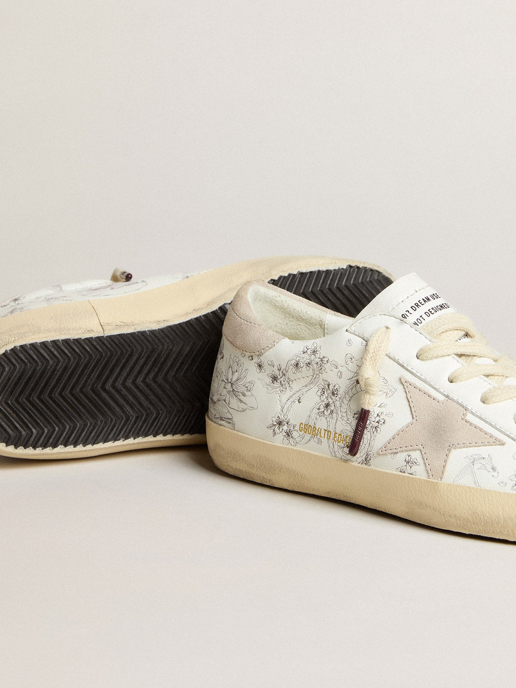 Women’s Super-Star LTD CNY in white leather with lettering on the upper