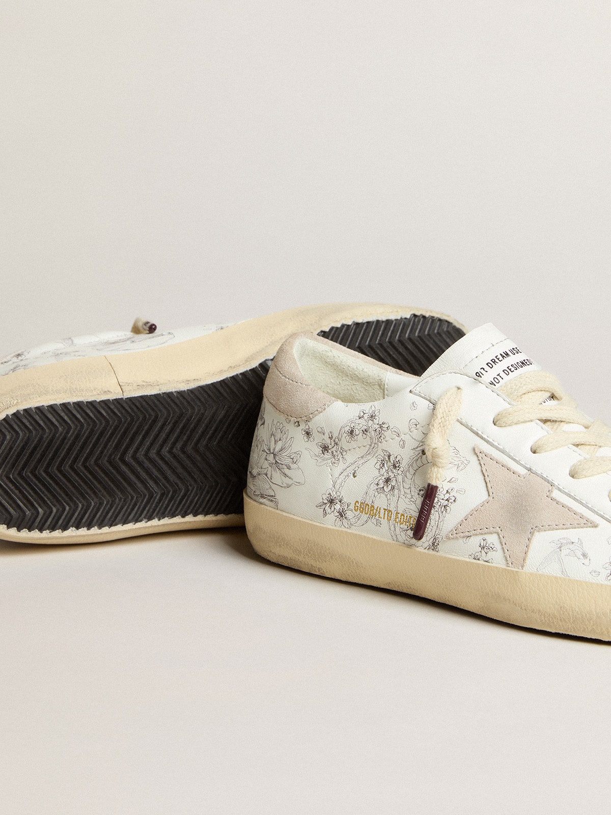 Women’s Super-Star LTD CNY in white leather with lettering on the upper
