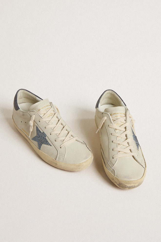 Super-Star LTD with cream-colored leather star with Swarovski crystals and blue leather heel tab with lizard print