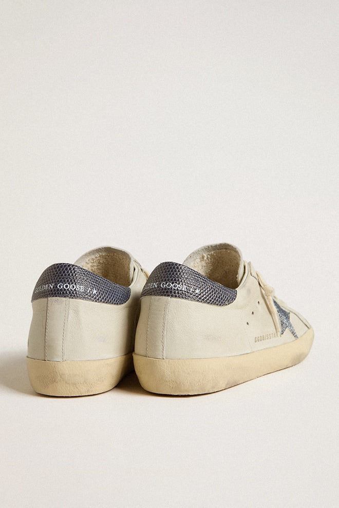 Super-Star LTD with cream-colored leather star with Swarovski crystals and blue leather heel tab with lizard print