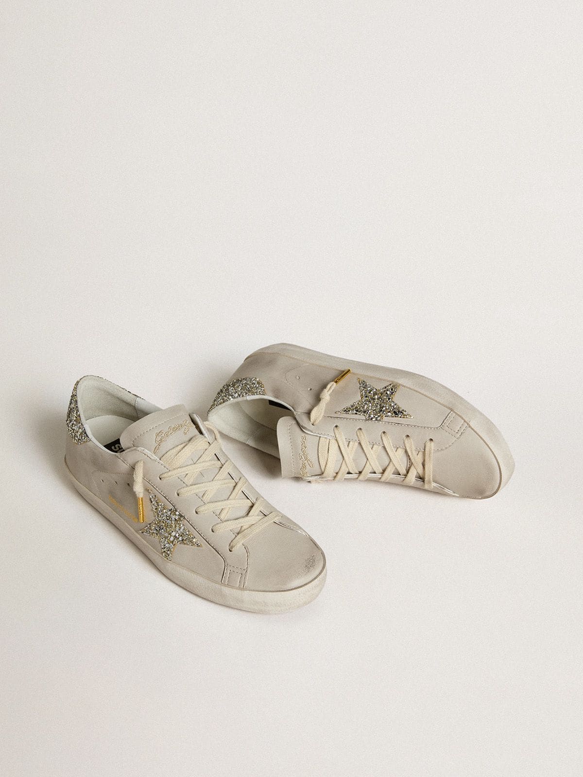 Women's Super-Star LTD in ivory nappa leather with platinum glitter star and heel tab