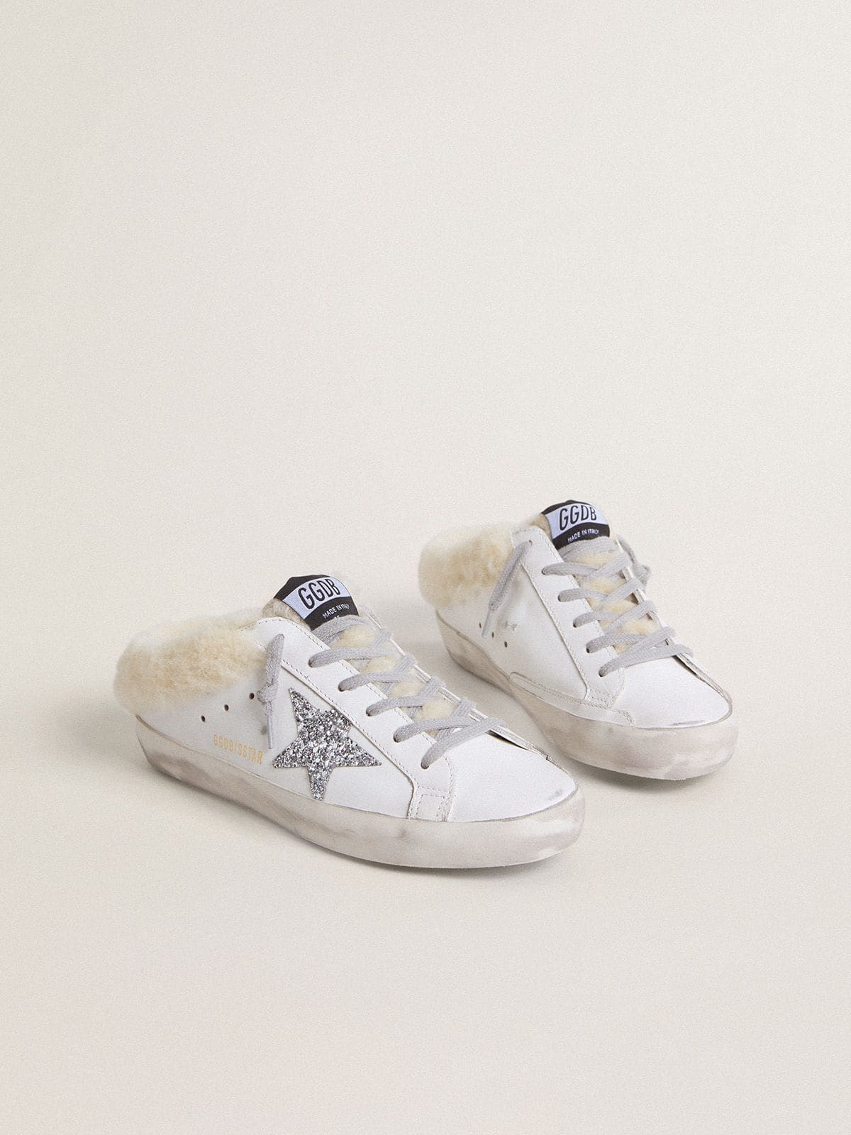 Super-Star Sabots in white leather with shearling lining and silver star
