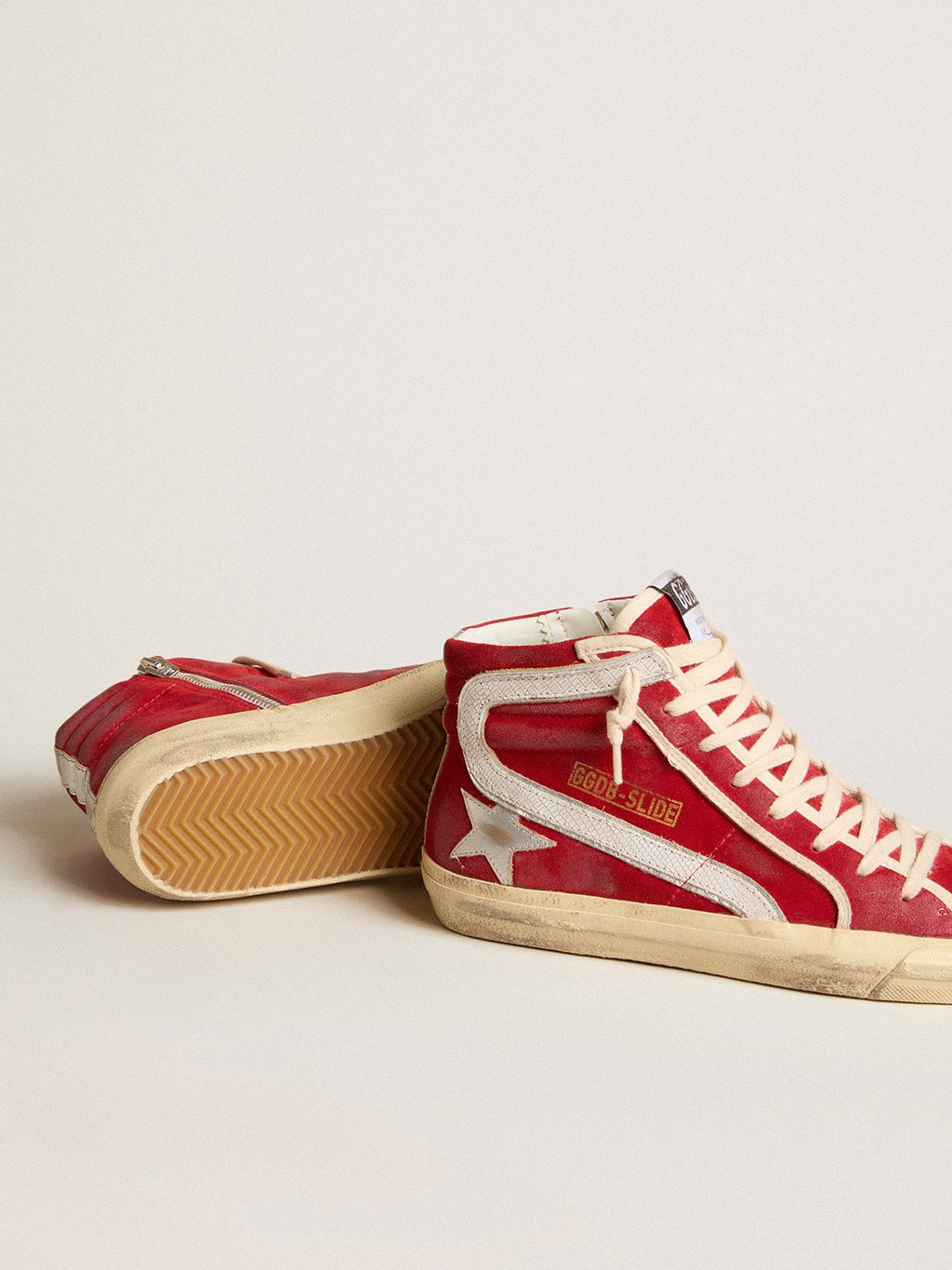 Slide in red suede with silver star and lizard print flash