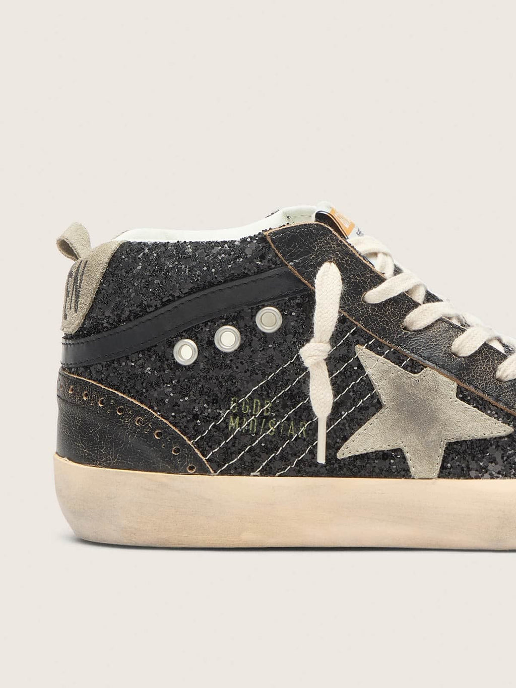 Women’s Mid Star in black glitter with dove-gray suede star and heel tab