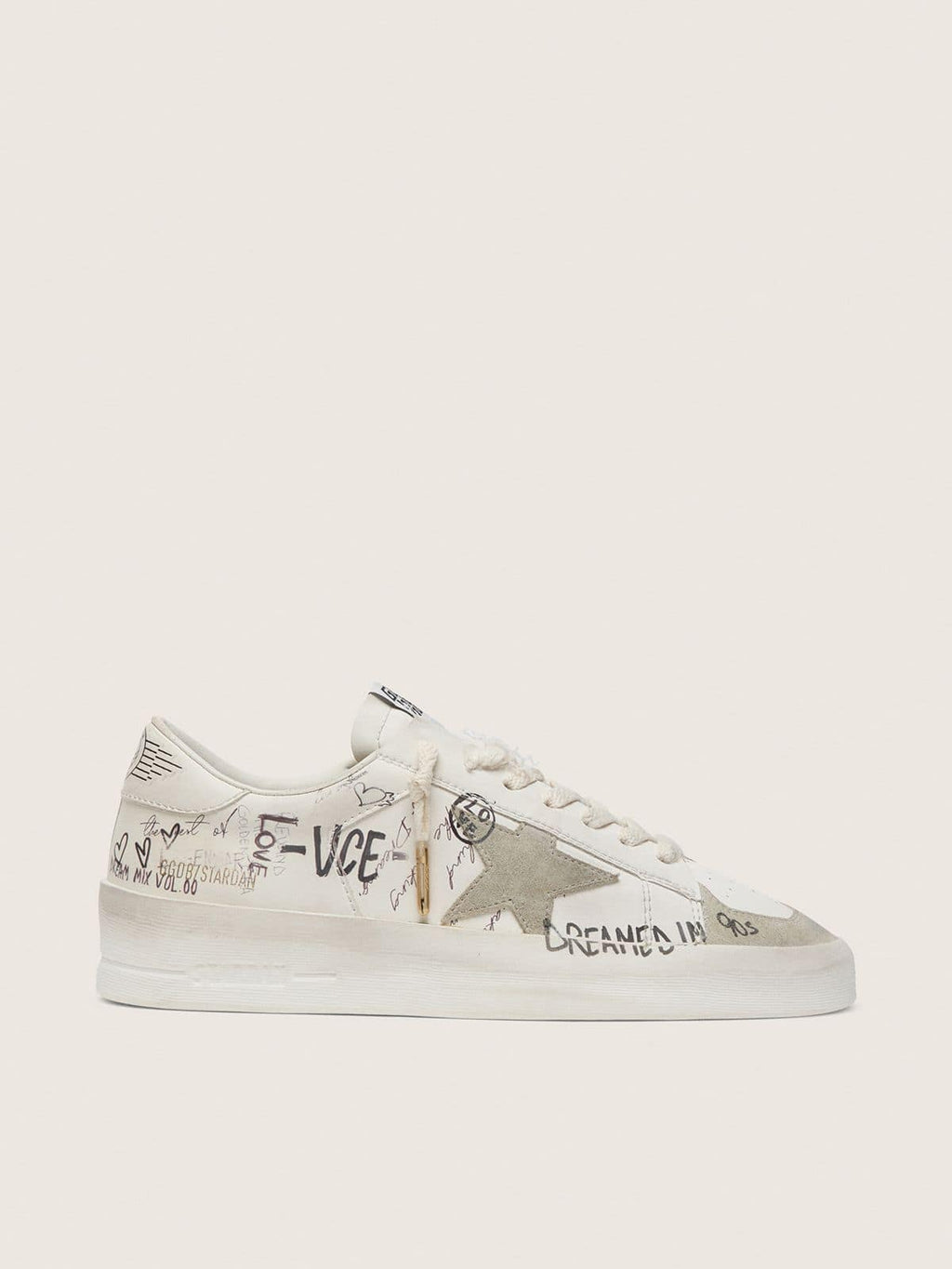 Stardan with beige suede star and toe and all-over lettering and patterns