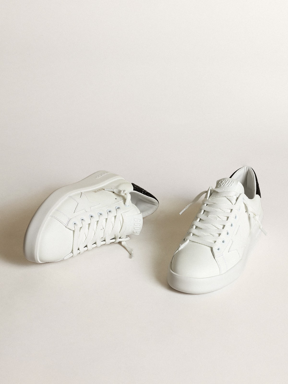 Purestar in white leather with tone-on-tone star and heel tab in black Swarovski crystals