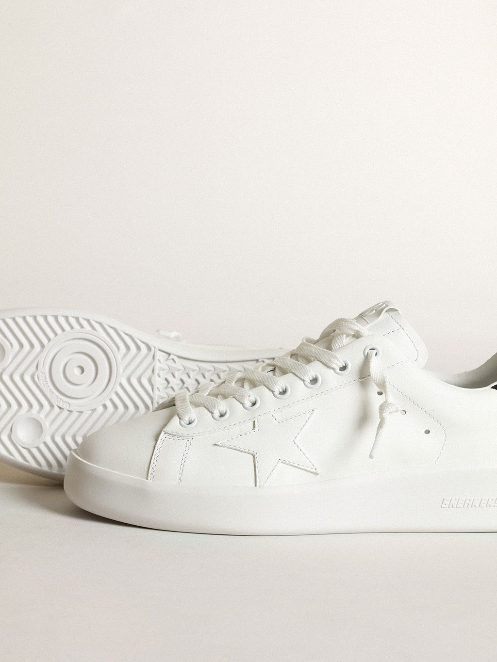 Purestar in white leather with tone-on-tone star and heel tab in black Swarovski crystals