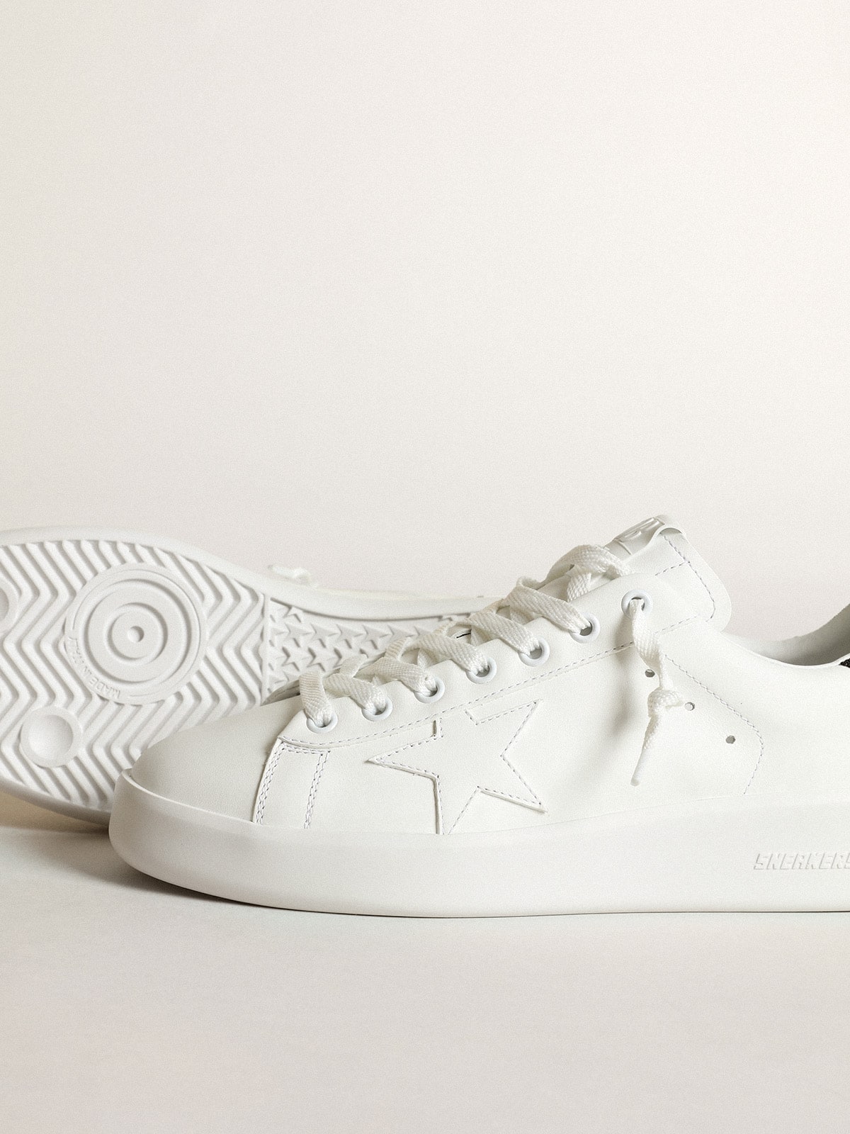 Purestar in white leather with tone-on-tone star and heel tab in black Swarovski crystals