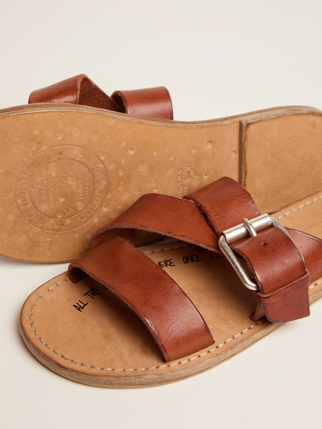 Margaret flat sandals in resin-coated leather