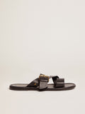 Margaret flat sandals in black resin-coated leather