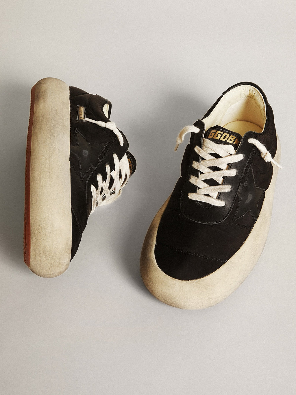 Space-Star shoes in black nylon with black leather star and heel tab