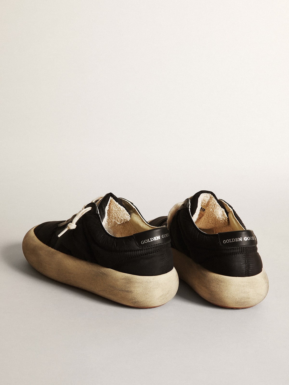 Space-Star shoes in black nylon with black leather star and heel tab