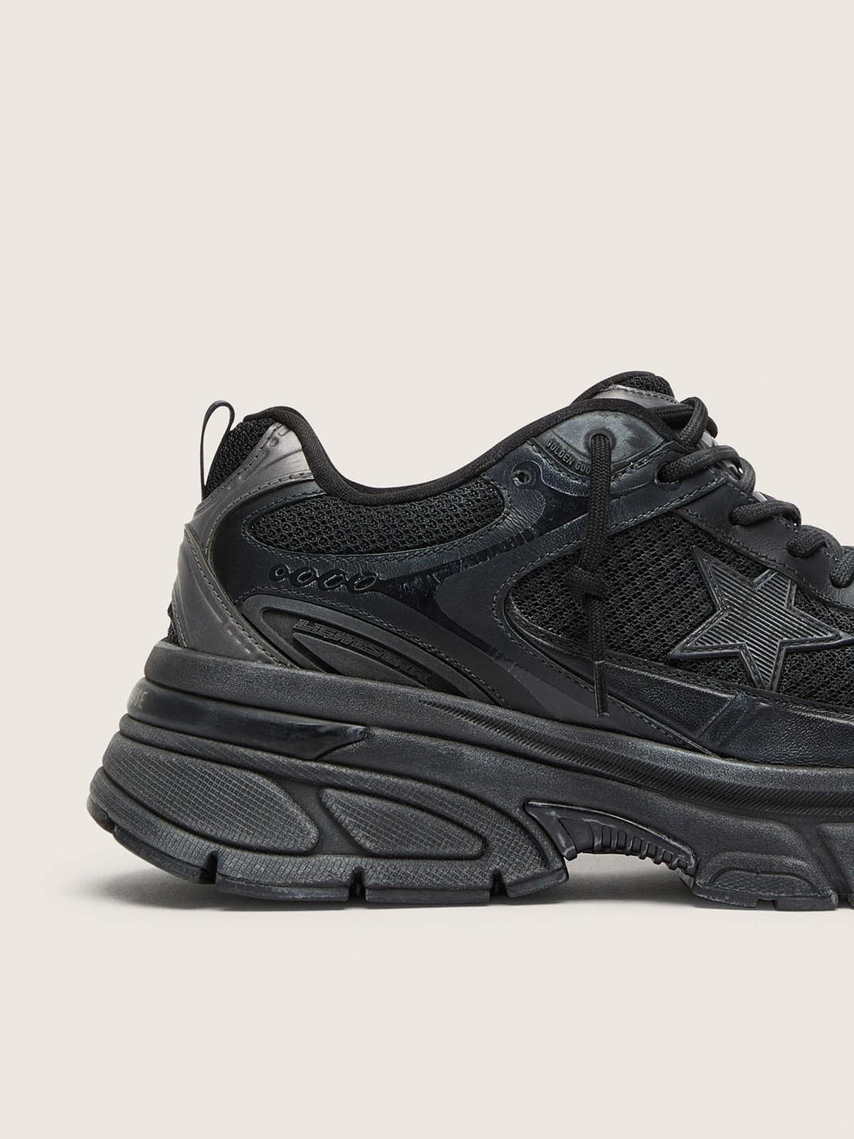 Women’s Lightstar with black leather and mesh upper and black star