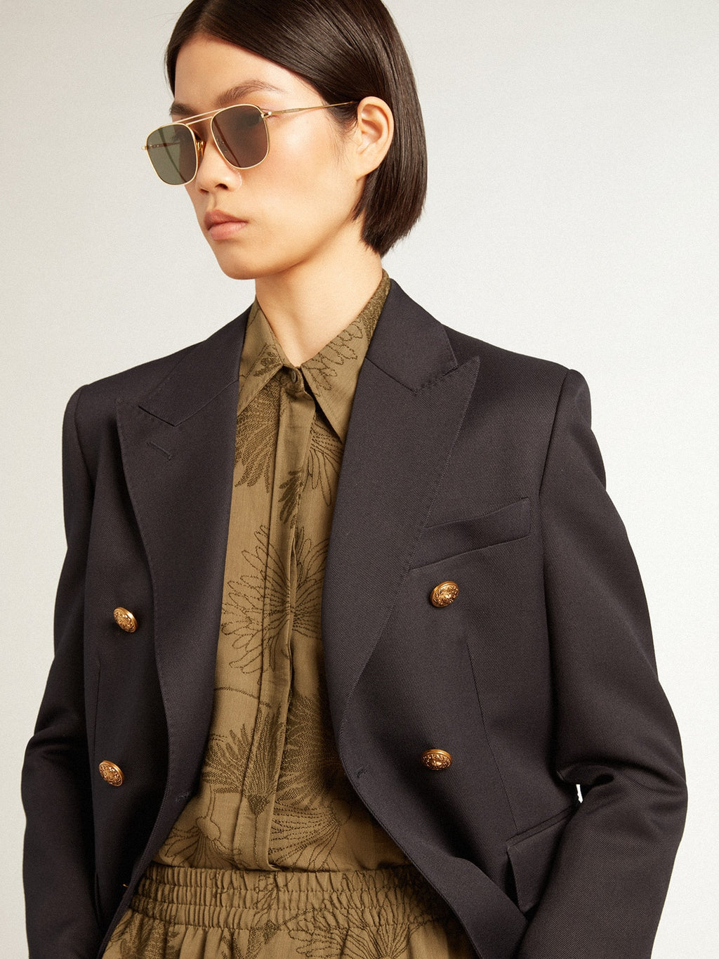 Women's olive-colored viscose-cotton blend shirt with floral pattern