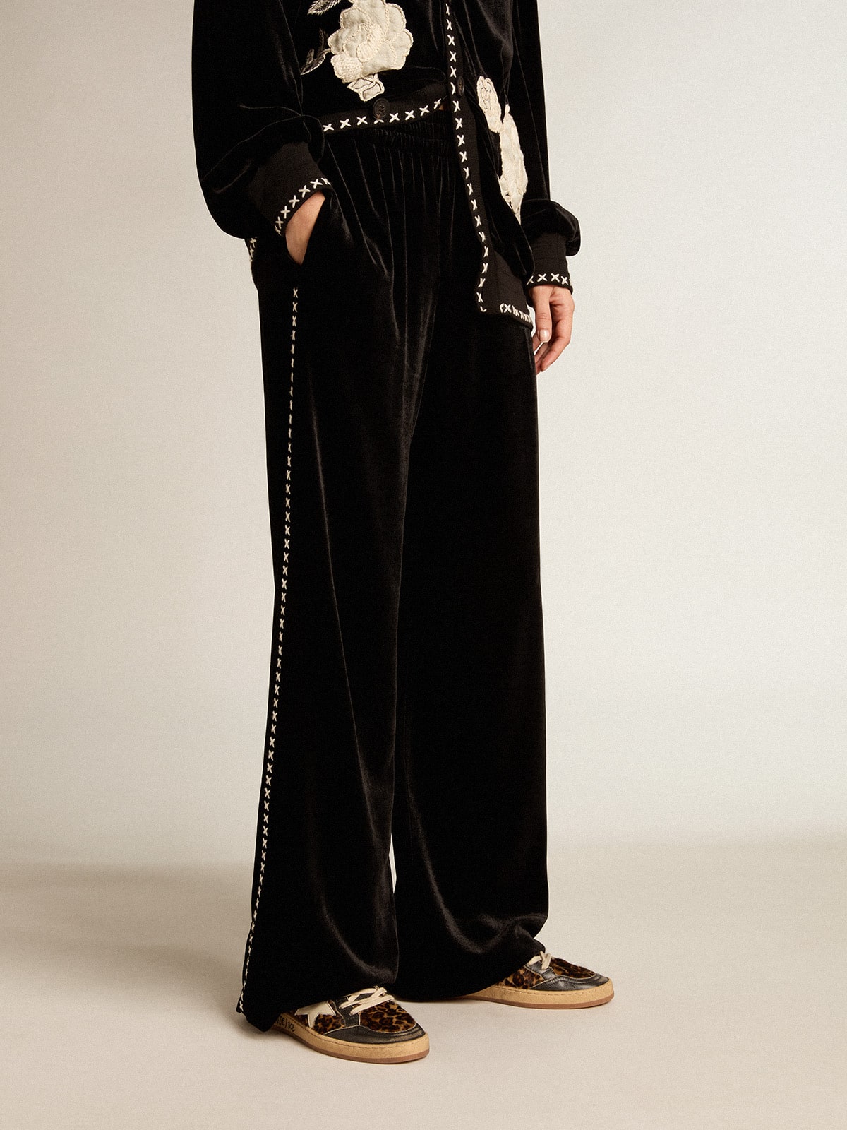 Black joggers with white embroidery