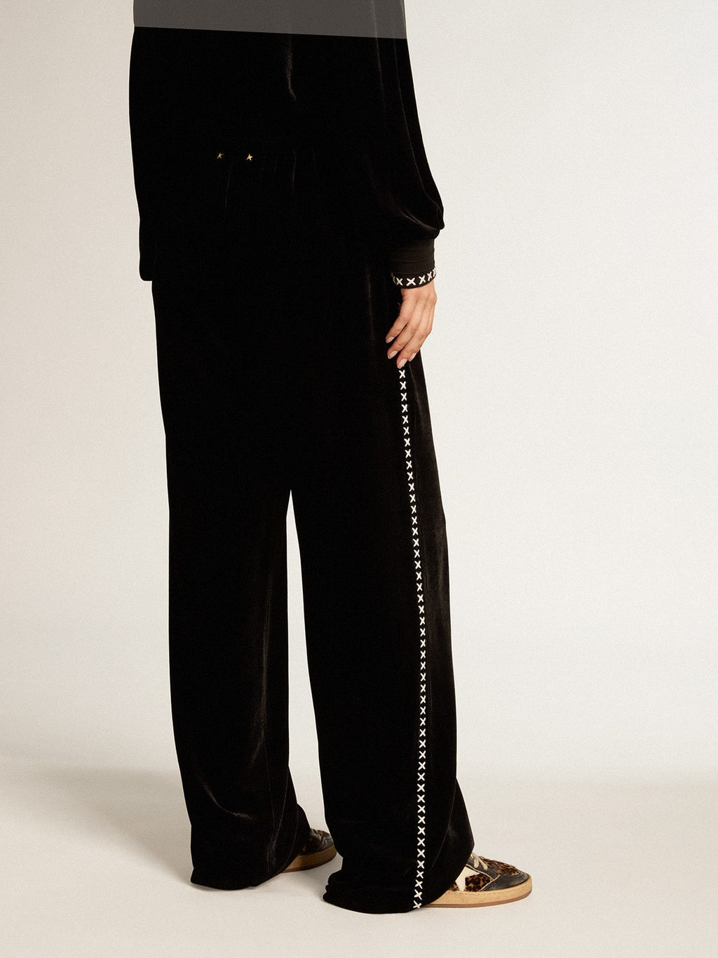 Black joggers with white embroidery