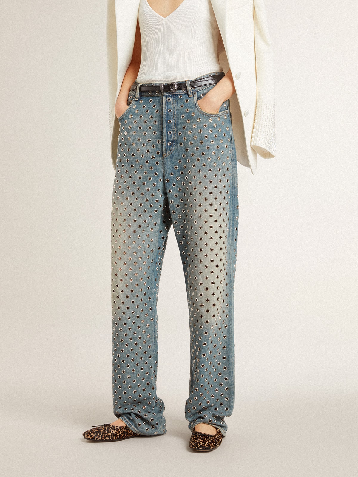 Women's washed jeans with all-over eyelets