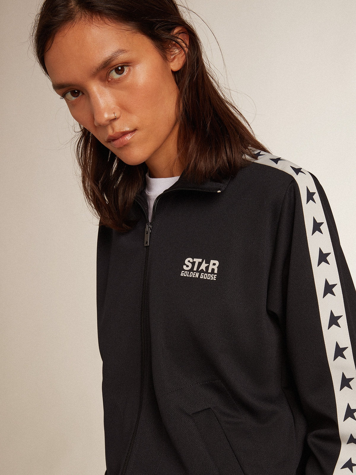Dark blue zipped sweatshirt with white strip and contrasting stars