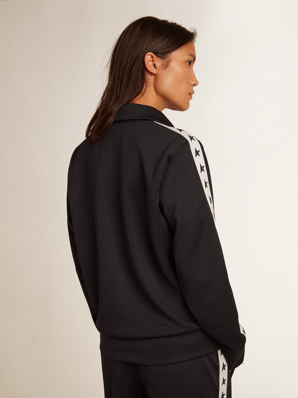 Dark blue zipped sweatshirt with white strip and contrasting stars