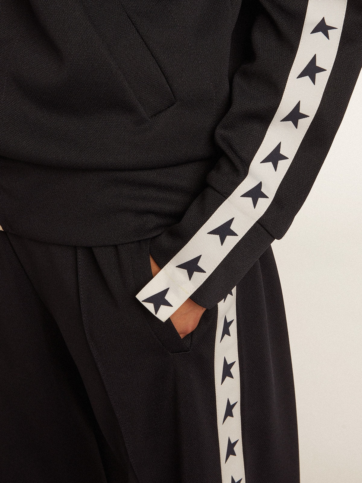 Dark blue zipped sweatshirt with white strip and contrasting stars