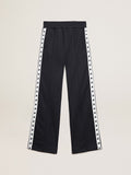 Dark blue joggers with white strip and contrasting stars