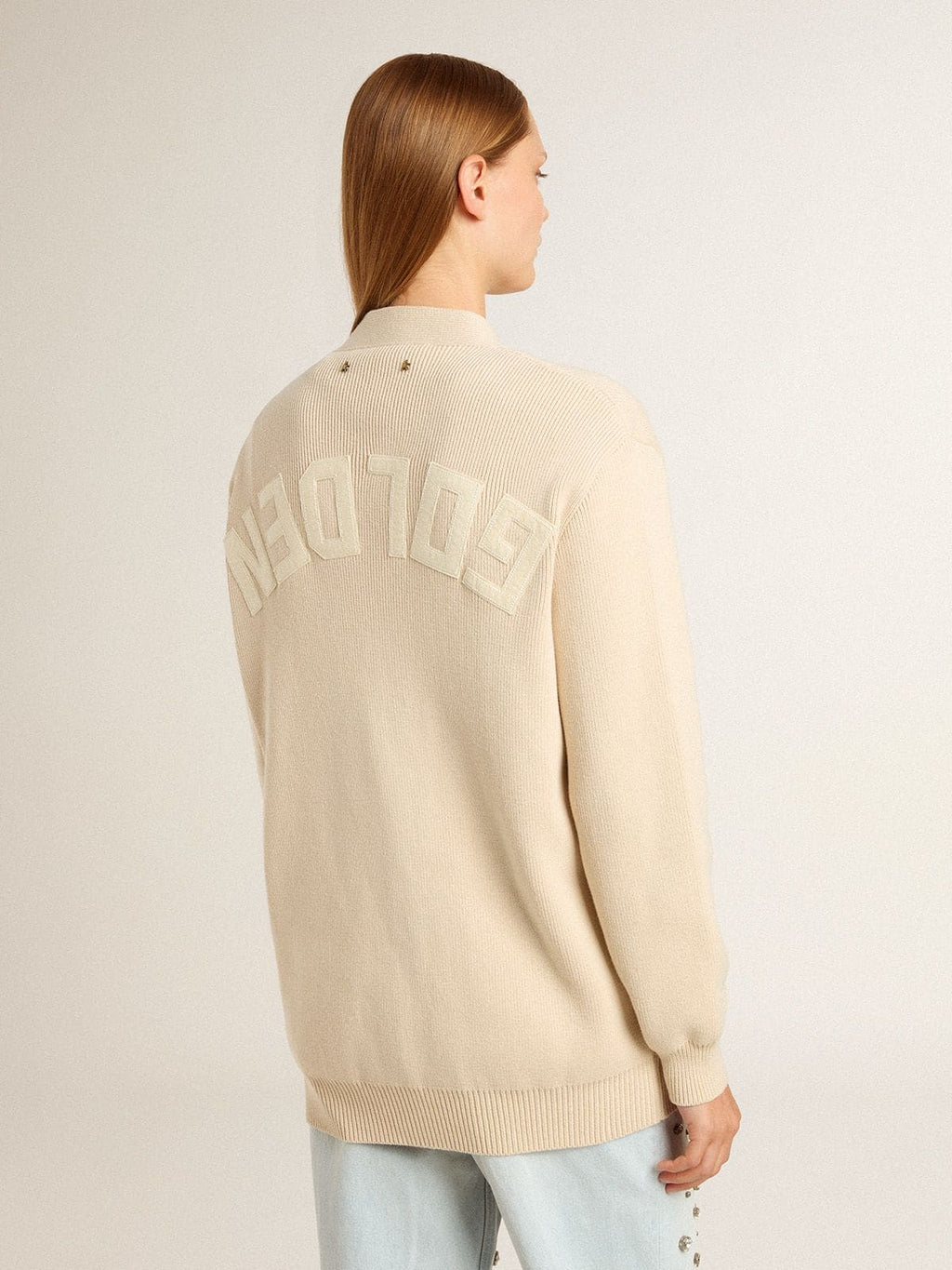 Women’s beige cardigan with 'Golden' lettering on the back
