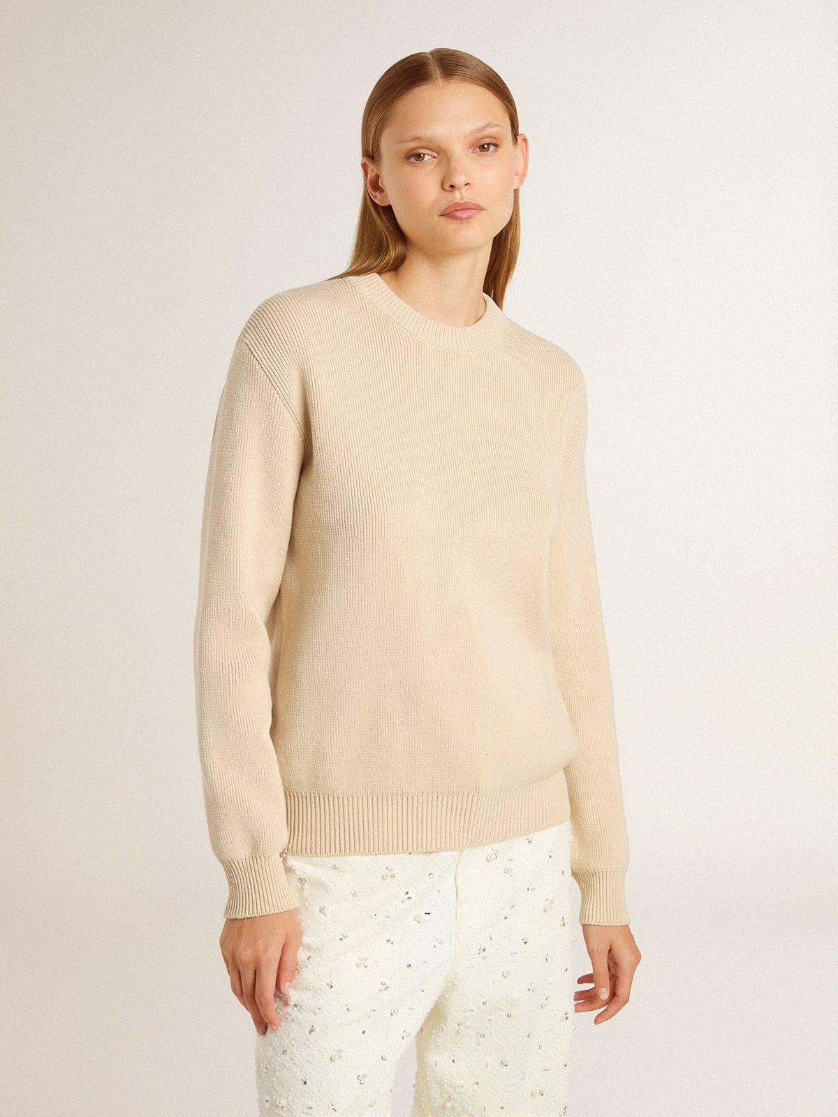 Women's beige sweater with 'Golden' lettering on the back