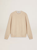 Women's beige sweater with 'Golden' lettering on the back