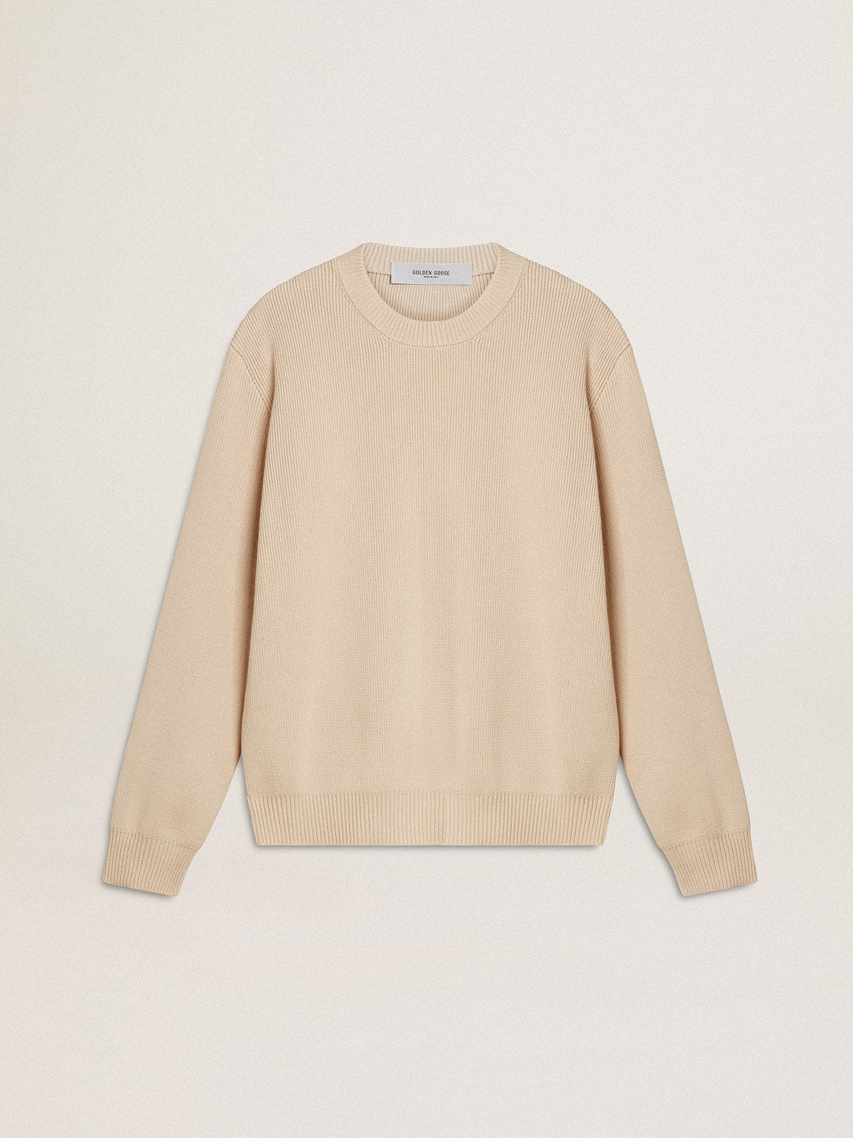 Women's beige sweater with 'Golden' lettering on the back