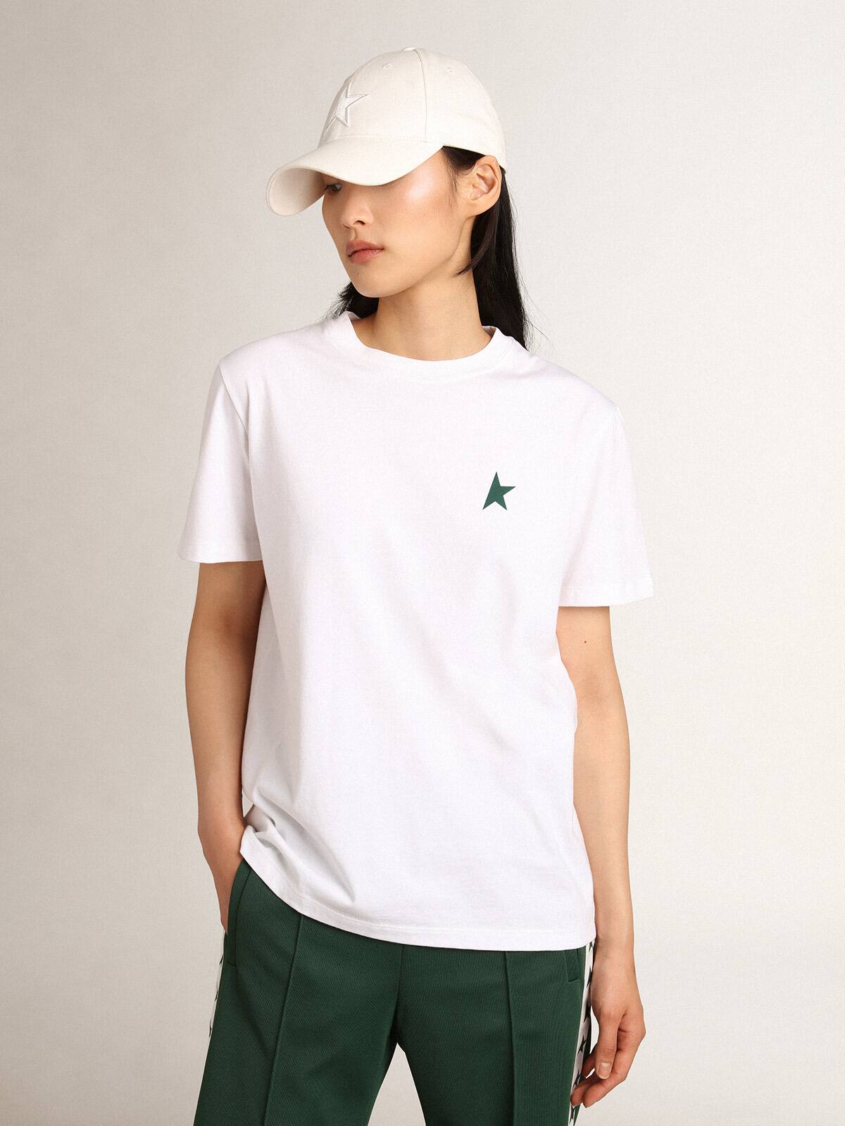 Women's white T-shirt with green star on the front