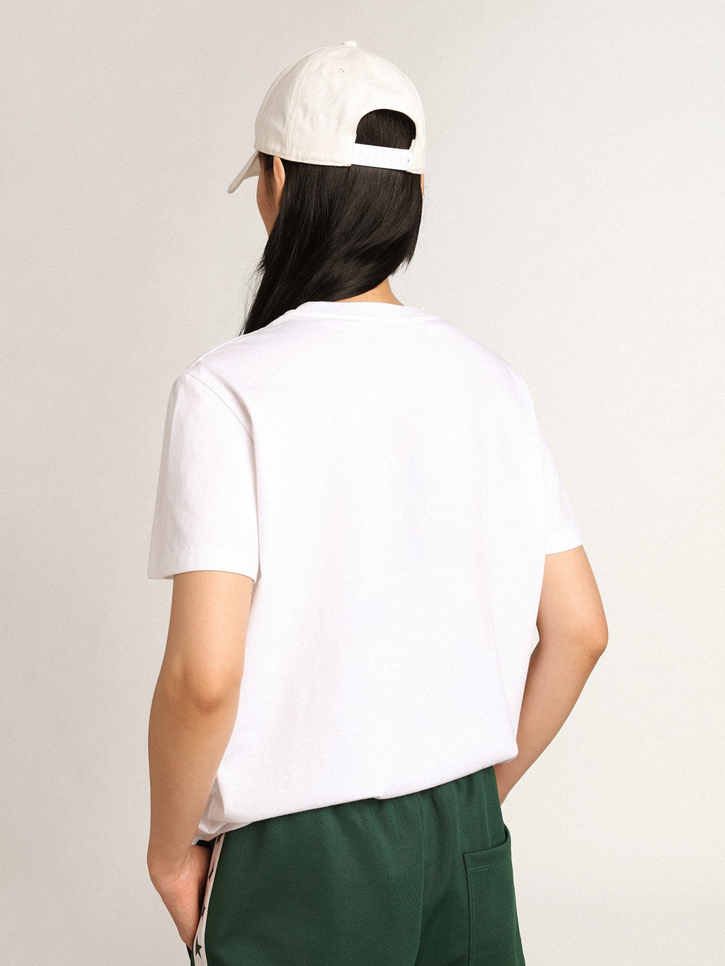 Women's white T-shirt with green star on the front
