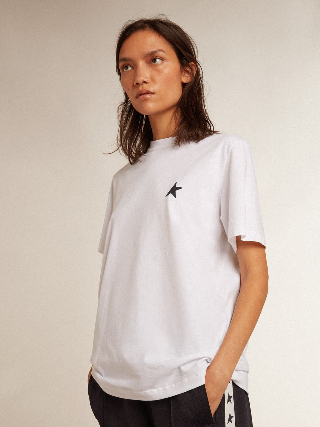 Women’s white T-shirt with dark blue star on the front