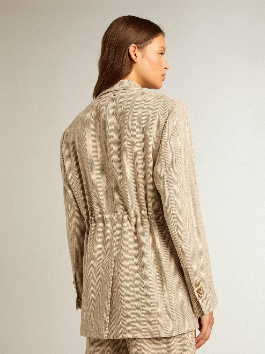 Women’s beige double-breasted blazer with button fastening