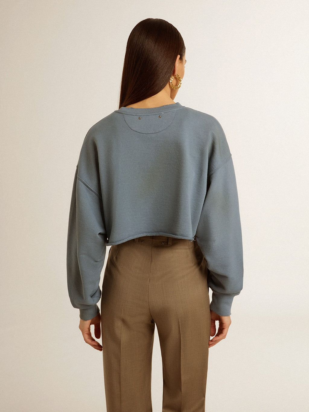 Cropped sweatshirt in baby blue with distressed finish