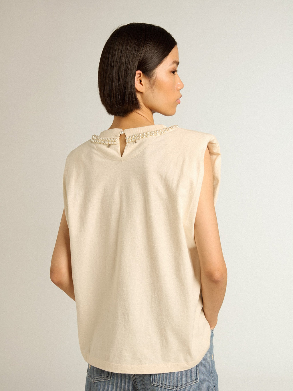 Aged white sleeveless T-shirt with pearl embroidery
