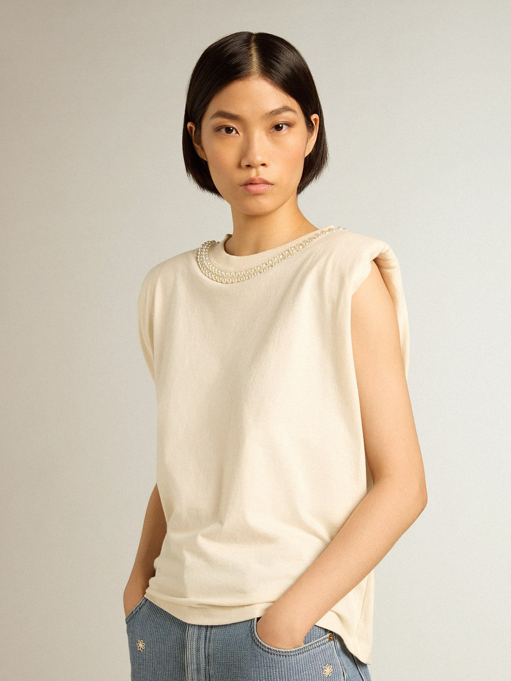 Aged white sleeveless T-shirt with pearl embroidery