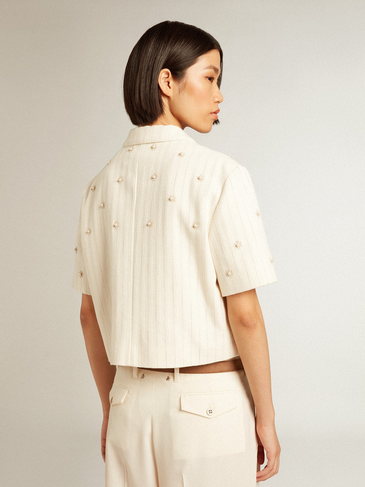 Aged white jacket in pinstripe cotton with all-over floral embroidery