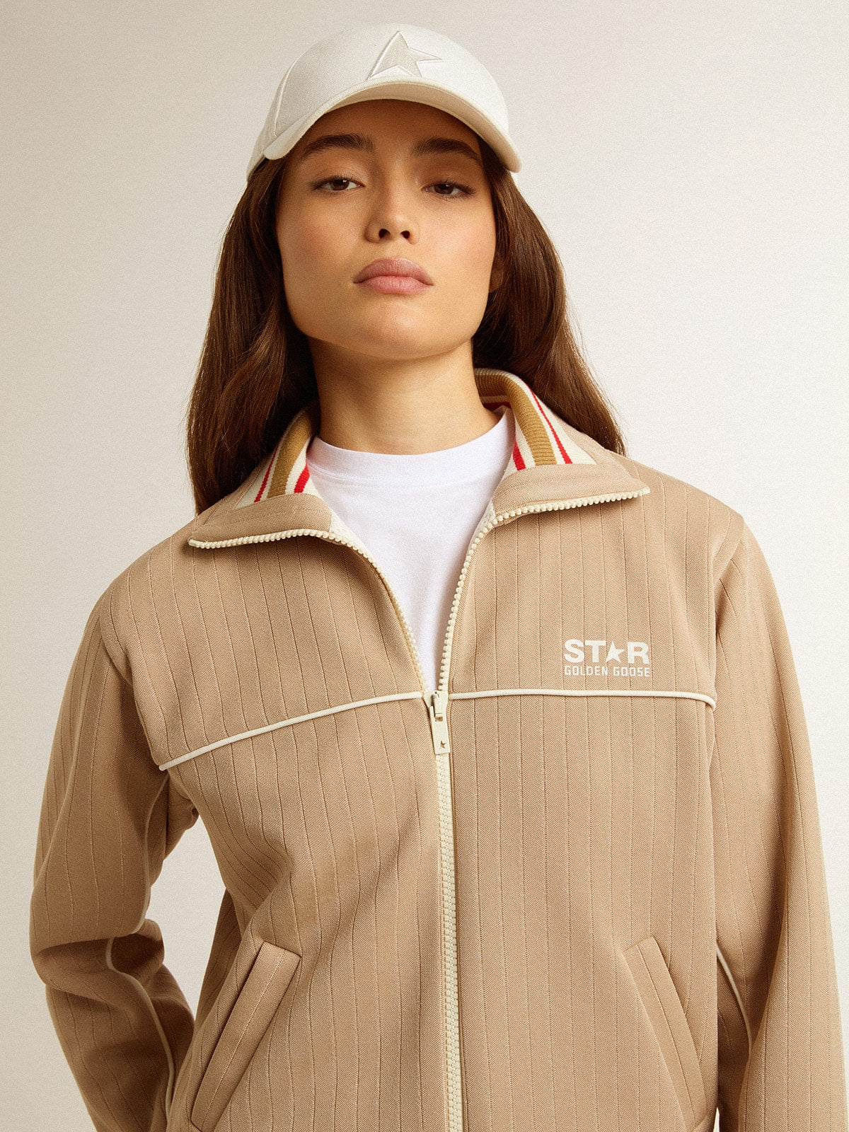 Women’s light beige zipped sweatshirt with white logo