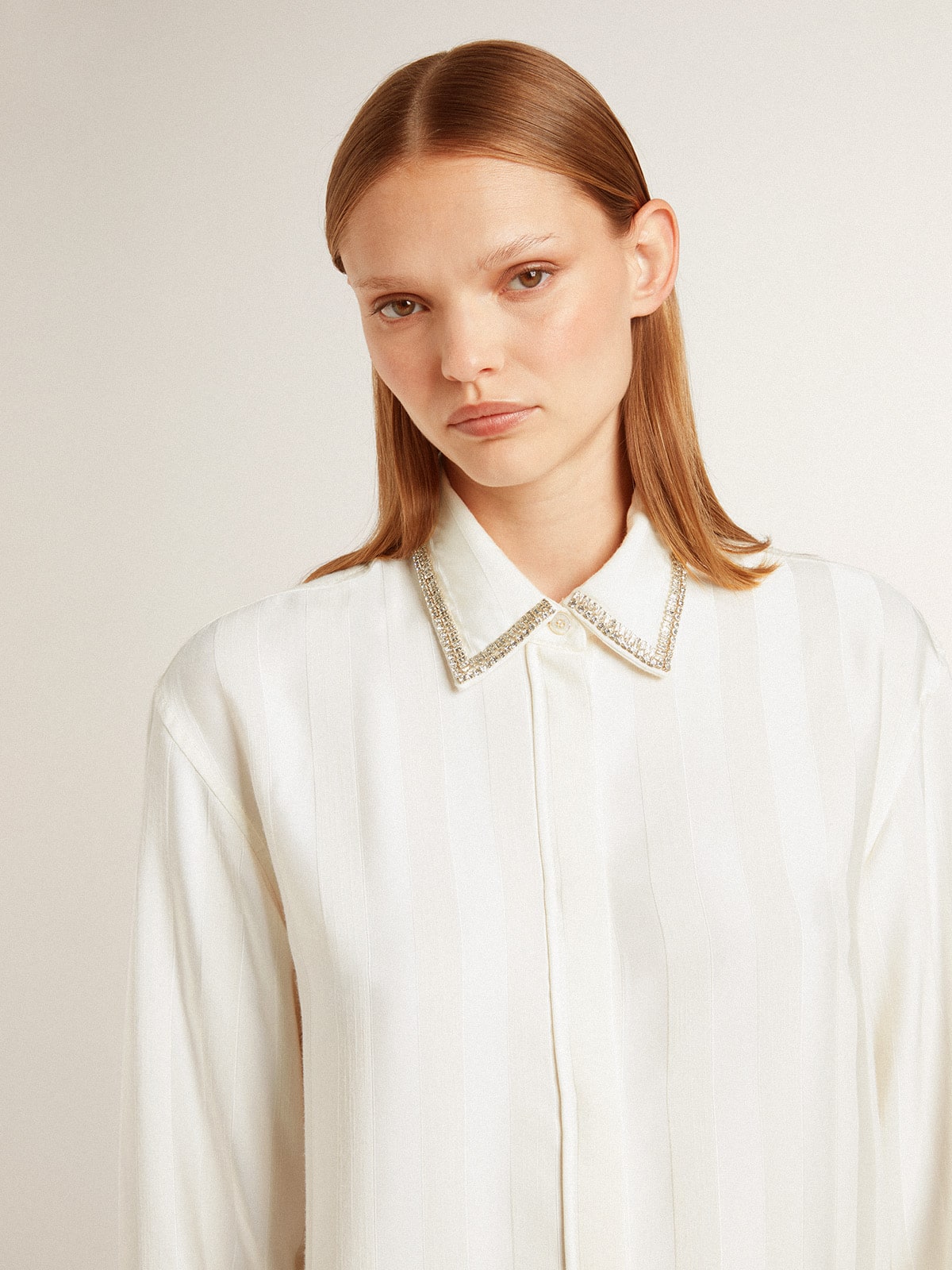 Women's shirt with a vertical striped pattern and crystal embroidery