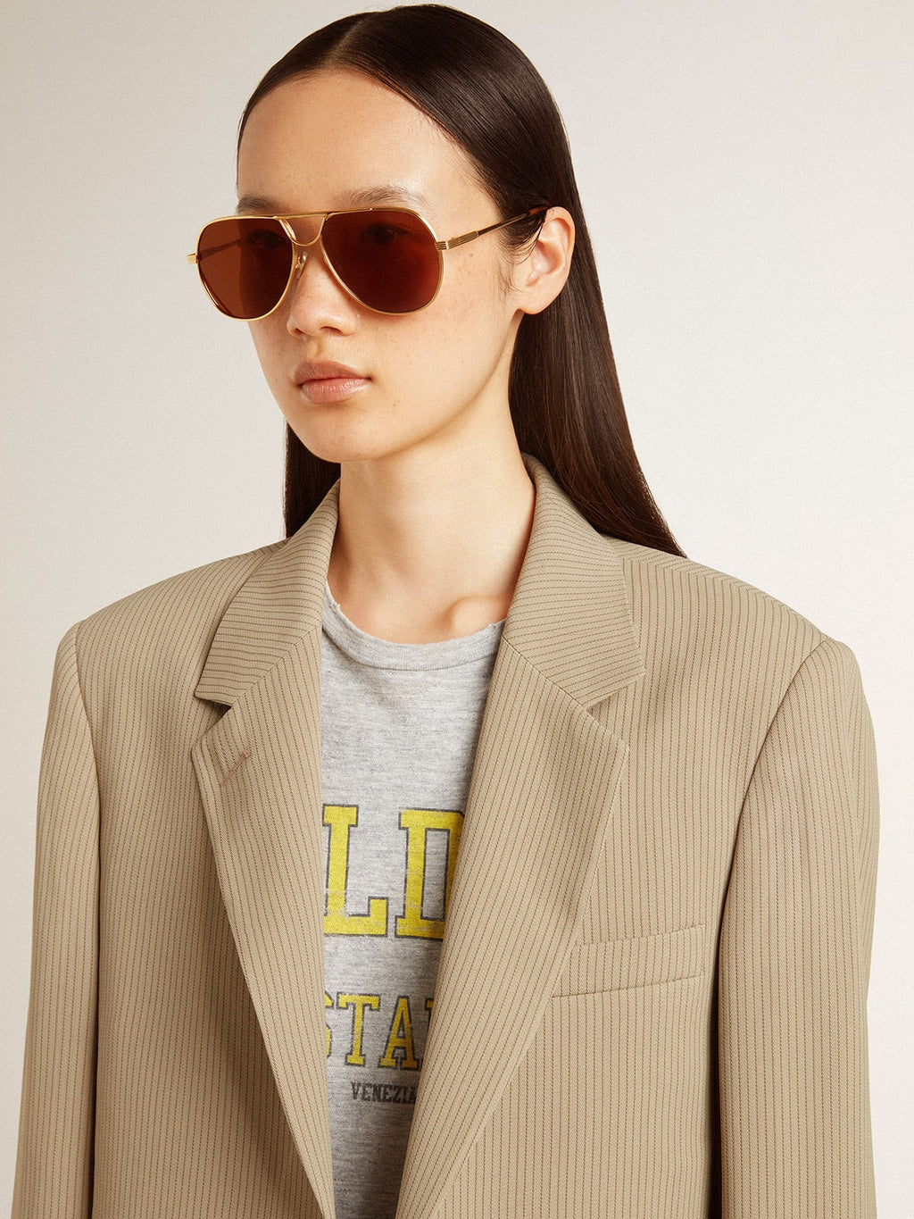 Women's beige pinstripe single-breasted jacket with an oversized fit