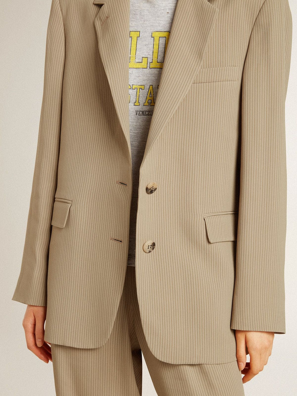 Women's beige pinstripe single-breasted jacket with an oversized fit